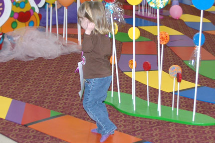 Little Girl Moving Forward on the Life-Sized Candy